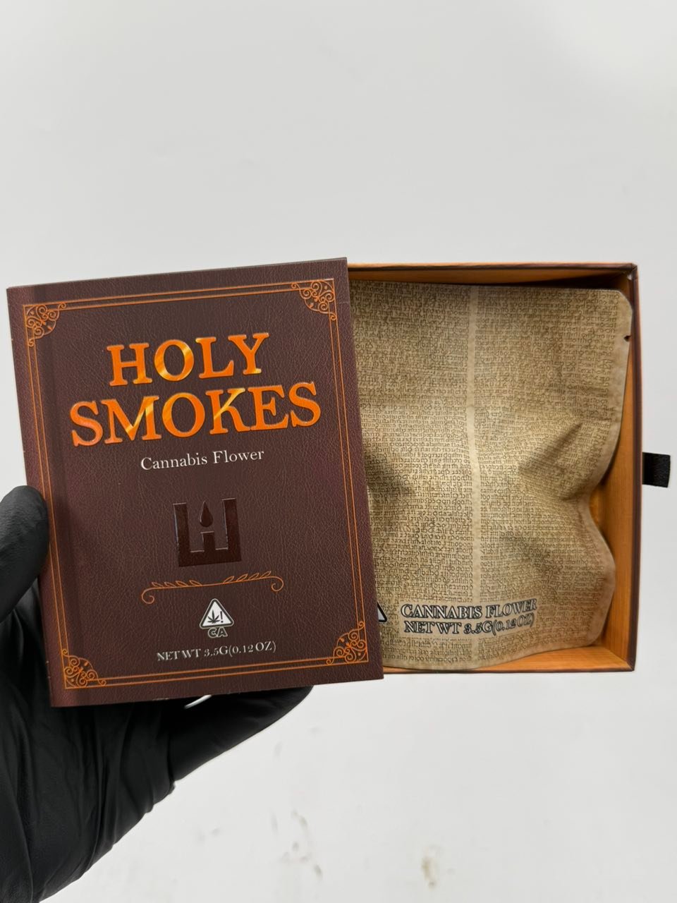 Open Holy Smokes Cannabis Flower presentation box with inner pouch Open Holy Smokes Cannabis Flower presentation box with inner pouch