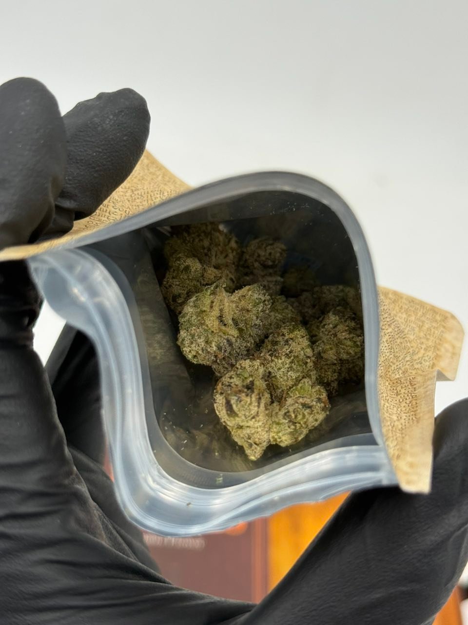Holy Smokes 3.5g cannabis flower in an open resealable pouch Holy Smokes 3.5g cannabis flower in an open resealable pouch
