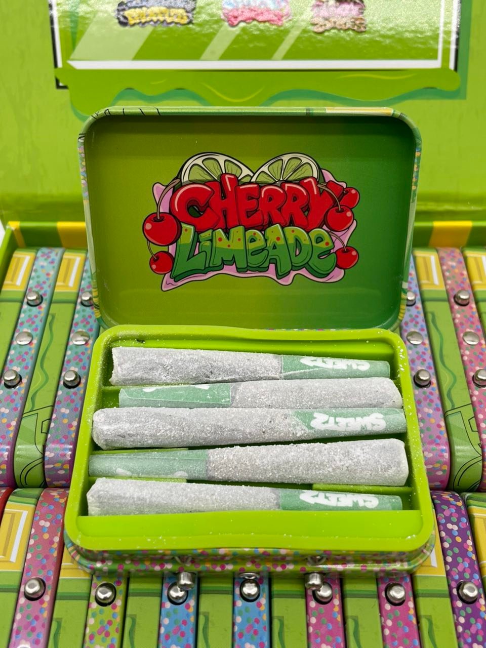 Sweetz Pixie Sticks Premium Mini Pre-Rolls — Cherry Limeade Tin Open Sweetz Pixie Sticks Premium Mini Pre-Rolls — Cherry Limeade tin open