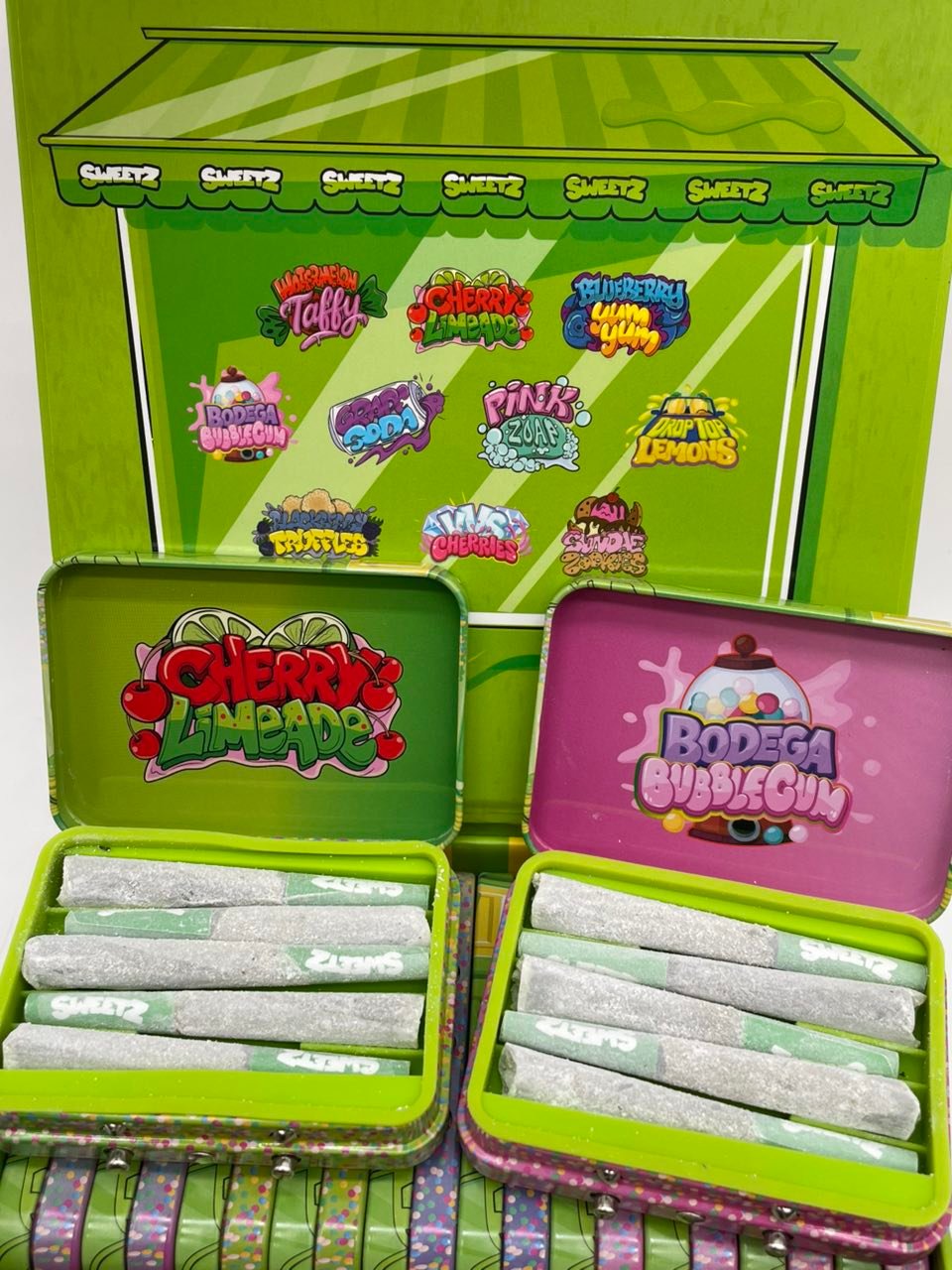 Sweetz Pixie Sticks Premium Mini Pre-Rolls — Two Tins With Ten-Flavor Artwork Sweetz Pixie Sticks Premium Mini Pre-Rolls — two tins with ten-flavor artwork